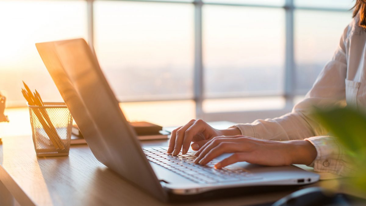 Person typing on a computer